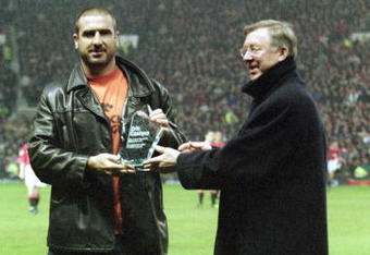 10 Apr 2001:  Former legend and crowd favourite Eric Cantona receives his award of best ever Manchester United player from Manchester United manager Alex Ferguson before the FA Carling Premiership match against Charlton Athletic played at Old Trafford, in Manchester, England. Manchester United won the match 2-1. \ Mandatory Credit: Laurence Griffiths /Allsport