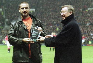 10 Apr 2001:  Former legend and crowd favourite Eric Cantona receives his award of best ever Manchester United player from Manchester United manager Alex Ferguson before the FA Carling Premiership match against Charlton Athletic played at Old Trafford, in Manchester, England. Manchester United won the match 2-1. \ Mandatory Credit: Laurence Griffiths /Allsport