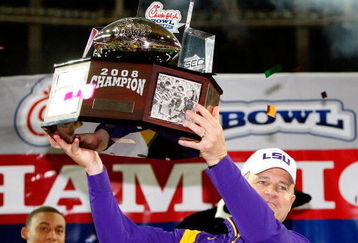 ATLANTA - DECEMBER 31:  Head coach Les Miles of the LSU Tigers lifts up the trophy after a 38-3 win over the Georgia Tech Yellow Jackets in the Chick-fil-A Bowl on December 31, 2008 at the Georgia Dome in Atlanta, Georgia.  (Photo by Kevin C. Cox/Getty Images)