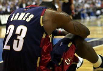 ORLANDO, FL - MAY 30: LeBron James #23 of the Cleveland Cavaliers sits on the court after being fouled by the Orlando Magic in Game Six of the Eastern Conference Finals during the 2009 Playoffs at Amway Arena on May 30, 2009 in Orlando, Florida. NOTE TO USER: User expressly acknowledges and agrees that, by downloading and or using this photograph, User is consenting to the terms and conditions of the Getty Images License Agreement  (Photo by Elsa/Getty Images)