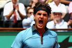 PARIS - JUNE 01:  Roger Federer of Switzerland celebrates victory during the Men's Singles Fourth Round match against Tommy Haas of Germany on day nine of the French Open at Roland Garros on June 1, 2009 in Paris, France.  (Photo by Clive Brunskill/Getty Images)