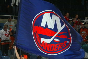 UNIONDALE, NY - OCTOBER 31:  An 'Ice Girl' of the New York Islanders carries a Islanders flag after the team defeated the Chicago Blackhawks on October 31, 2006 at Nassau Coliseum in Uniondale, New York.  (Photo by Jim McIsaac/Getty Images)