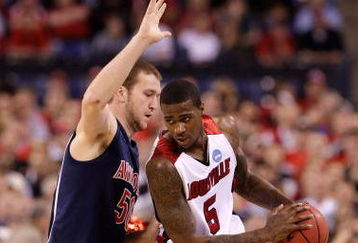 INDIANAPOLIS - MARCH 27:  Earl Clark #5 of the Louisville Cardinals looks to pass the ball against Alex Jacobson #50 of the Arizona Wildcats during the third round of the NCAA Division I Men's Basketball Tournament at the Lucas Oil Stadium on March 27, 2009 in Indianapolis, Indiana.  (Photo by Andy Lyons/Getty Images)
