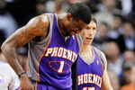 LOS ANGELES, CA - FEBRUARY 18:  Amar'e Stoudamire #1 of the Phoenix Suns is comforted by teammate Steve Nash #13 after a collision with Al Thornton #12 of the Los Angeles Clippers during the first half action against at the Staples Center February 18, 2009, in Los Angeles, California. The Suns have announced that Amare Stoudemire was forced to undergo surgery Friday to repair a partially detached retina in his right eye suffered in a Wednesday night rout of the Los Angeles Clippers. It is Stoudemire's second injury in that eye since October and threatens to sideline the All-Star forward for the rest of the regular season.NOTE TO USER: User expressly acknowledges and agrees that, by downloading and or using this photograph, User is consenting to the terms and conditions of the Getty Images License Agreement.  (Photo by Kevork Djansezian/Getty Images)