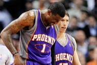 LOS ANGELES, CA - FEBRUARY 18:  Amar'e Stoudamire #1 of the Phoenix Suns is comforted by teammate Steve Nash #13 after a collision with Al Thornton #12 of the Los Angeles Clippers during the first half action against at the Staples Center February 18, 2009, in Los Angeles, California. The Suns have announced that Amare Stoudemire was forced to undergo surgery Friday to repair a partially detached retina in his right eye suffered in a Wednesday night rout of the Los Angeles Clippers. It is Stoudemire's second injury in that eye since October and threatens to sideline the All-Star forward for the rest of the regular season.NOTE TO USER: User expressly acknowledges and agrees that, by downloading and or using this photograph, User is consenting to the terms and conditions of the Getty Images License Agreement.  (Photo by Kevork Djansezian/Getty Images)
