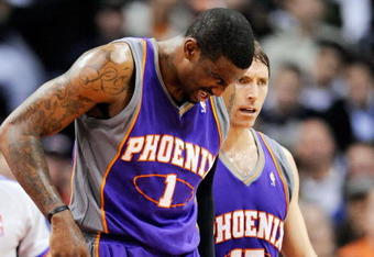 LOS ANGELES, CA - FEBRUARY 18:  Amar'e Stoudamire #1 of the Phoenix Suns is comforted by teammate Steve Nash #13 after a collision with Al Thornton #12 of the Los Angeles Clippers during the first half action against at the Staples Center February 18, 2009, in Los Angeles, California. The Suns have announced that Amare Stoudemire was forced to undergo surgery Friday to repair a partially detached retina in his right eye suffered in a Wednesday night rout of the Los Angeles Clippers. It is Stoudemire's second injury in that eye since October and threatens to sideline the All-Star forward for the rest of the regular season.NOTE TO USER: User expressly acknowledges and agrees that, by downloading and or using this photograph, User is consenting to the terms and conditions of the Getty Images License Agreement.  (Photo by Kevork Djansezian/Getty Images)