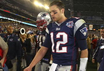 GLENDALE, AZ - FEBRUARY 03:  Quarterback Tom Brady #12 of the New England Patriots walks off the field after losing to the New York Giants 17-14 during Super Bowl XLII on February 3, 2008 at the University of Phoenix Stadium in Glendale, Arizona.  (Photo by Donald Miralle/Getty Images)