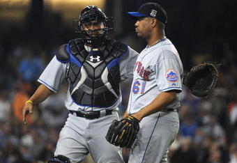 LOS ANGELES, CA - MAY 20:  Livan Hernandez #61 of the New York Mets gets a pat from Ramon Castro #11 after his strikeout to end the inning against the Los Angeles Dodgers during the seventh inning at Dodger Stadium May 20, 2009 in Los Angeles, California.  (Photo by Harry How/Getty Images)