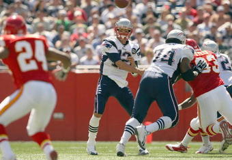 FOXBORO, MA - SEPTEMBER 7:  Quarterback Tom Brady #12 of the New England Patriots passes the ball up the middle during their NFL game against the Kansas City Chiefs on September 7, 2008 at Gillette Stadium in Foxboro, Massachusetts. The Patriots defeated the Chiefs 17-10. (Photo by Elsa Garrison/Getty Images)