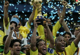 FRANKFURT, GERMANY - JUNE 29:  Ronaldinho, captain of Brazil, lifts the trophy following the FIFA 2005 Confederations Cup Final between Brazil and Argentina at the Waldstadion June 29, 2005, in Frankfurt, Germany.  (Photo by Ben Radford/Getty Images)