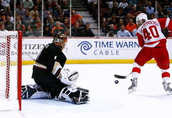 ANAHEIM, CA - MAY 12:  Goaltender Jonas Hiller #1 of the Anaheim Ducks defends the goal against Henrik Zetterberg #40 of the Detroit Red Wings during Game Six of the Western Conference Semifinal Round of the 2009 Stanley Cup Playoffs at the Honda Center on May 12, 2009 in Anaheim, California. (Photo by Jeff Gross/Getty Images)