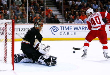 ANAHEIM, CA - MAY 12:  Goaltender Jonas Hiller #1 of the Anaheim Ducks defends the goal against Henrik Zetterberg #40 of the Detroit Red Wings during Game Six of the Western Conference Semifinal Round of the 2009 Stanley Cup Playoffs at the Honda Center on May 12, 2009 in Anaheim, California. (Photo by Jeff Gross/Getty Images)