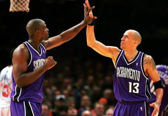 NEW YORK - JANUARY 4:  Doug Christie #13 and Chris Webber #4 of the Sacramento Kings high five in the third period of their game against the New York Knicks on January 4, 2005 at Madison Square Garden in New York City. NOTE TO USER: User expressly acknowledges and agrees that, by downloading and or using this photograph, User is consenting to the terms and conditions of the Getty Images License Agreement.  (Photo by Ezra Shaw/Getty Images)