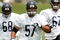 BOURBONNAIS, IL - JULY 27: Offensive lineman Olin Kreutz #57, Anthony Oakley #68 and Travis Leffew #67 of the Chicago Bears work out during the first summer training camp practice on July 27, 2006 at Olivet Nazarene University in Bourbonnais, Illinois.  (Photo by Jonathan Daniel/Getty Images)