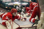 DETROIT - MAY 31:  Chris Osgood #30, and Brad Stuart #23 of the Detroit Red Wings defend the net against Bill Guerin #13 of the Pittsburgh Penguins during Game Two of the 2009 Stanley Cup Finals at Joe Louis Arena on May 31, 2009 in Detroit, Michigan.  (Photo by Jim McIsaac/Getty Images)