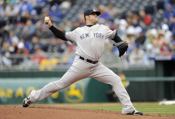 KANSAS CITY, MO - APRIL 12:  Joba Chamberlain #62 of the New York Yankees delivers the pitch against the Kansas City Royals on April 12, 2009 at Kauffman Stadium in Kansas City, Missouri. (Photo by G. Newman Lowrance/Getty Images)