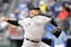 KANSAS CITY, MO - APRIL 12:  Joba Chamberlain #62 of the New York Yankees delivers the pitch against the Kansas City Royals on April 12, 2009 at Kauffman Stadium in Kansas City, Missouri. (Photo by G. Newman Lowrance/Getty Images)