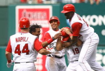 ANAHEIM, CA - MAY 31:  (L-R) Mike Napoli #44, Erick Aybar #2, Juan Rivera #20, Kendry Morales #19 and Gary Matthews Jr.#24 # of the Los Angeles Angels of Anaheim celebrate Morales' game winning RBI single in the ninth inning against the Seattle Mariners at Angel Stadium on May 31, 2009 in Anaheim, California. The Angels defeated the mariners 9-8.  (Photo by Jeff Gross/Getty Images)