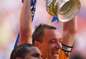 LONDON, ENGLAND - MAY 30:  John Terry of Chelsea with lifts the trophy with Florent Malouda after the FA Cup sponsored by E.ON Final match between Chelsea and Everton at Wembley Stadium on May 30, 2009 in London, England.  (Photo by Mike Hewitt/Getty Images)