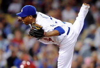 LOS ANGELES, CA - MAY 23:  Pitcher Ronlad Belisario #54 of the Los Angeles Dodgers throws against the Los Angeles Angels of Anaheim during the baseball game at Dodger Stadium on May 23, 2009 in Los Angeles, California.  (Photo by Kevork Djansezian/Getty Images)