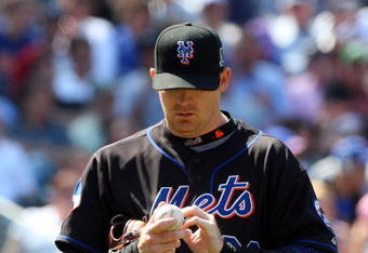 NEW YORK - MAY 13:  J.J. Putz #22 of the New York Mets looks on against the Atlanta Braves on May 13, 2009 at Citi Field in the Flushing neighborhood of the Queens borough of New York City. The Braves defeated the Mets 8-7 in twelve innings.  (Photo by Jim McIsaac/Getty Images)