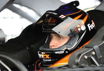 CONCORD, NC - MAY 15: Denny Hamlin, driver of the #11 FedEx Express Toyota sits in his car during qualifying for the NASCAR Sprint All-Star Race on May 15, 2009 at Lowe's Motor Speedway in Concord, North Carolina.  (Photo by John Harrelson/Getty Images)