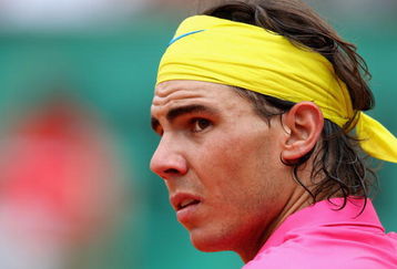 PARIS - MAY 31:  Rafael Nadal of Spain looks on during the Men's Singles Fourth Round match against Robin Soderling of Sweden on day eight of the French Open at Roland Garros on May 31, 2009 in Paris, France.  (Photo by Clive Brunskill/Getty Images)