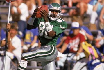 1987: Wide receiver Mike Quick #82 of the Philadelphia Eagles leaps to catch a pass down the sideline during a 1987 NFL game.  (Photo by Mike Powell/Getty Images)