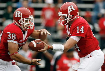 PISCATAWAY, NJ - SEPTEMBER 27:  Quarterback Mike Teel #14 of the Rutgers Scarlet Knights hands off to running back Joe Martinek #38 during the first quarter against the Morgan State Bears at Rutgers Stadium on September 27, 2008 in Piscataway, New Jersey.  (Photo by Jarrett Baker/Getty Images)