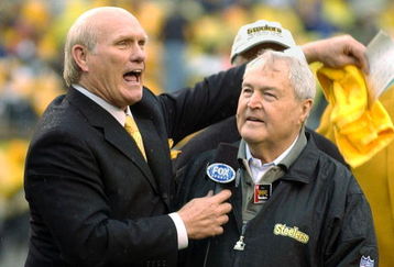 PITTSBURGH - OCTOBER 26:  Former quarterback Terry Bradshaw (L) and head coach Chuck Noll (R) of the Pittsburgh Steelers appear during a pre-game ceremony to celebrate the Steelers' 1000th game before the game against the St. Louis Rams on October 26, 2003 at Heinz Field in Pittsburgh, Pennsylvania. The Rams defeated the Steelers 33-21.  (Photo by David Maxwell/Getty Images)
