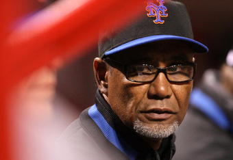 CINCINNATI, OH - APRIL 8: Manager Jerry Manuel of the New York Mets talks with his coaches during their game against the Cincinnati Reds during the inning at Great American Ballpark on April 8, 2009 in Cincinnati, Ohio. (Photo by Mark Lyons/Getty Images)