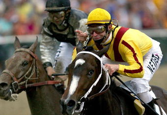 BALTIMORE - MAY 16:  Calvin Borel, riding Rachel Alexandra, crosses the finish line ahead of Mine That Bird to win the 134th Preakness Stakes at Pimlico Race Course on May 16, 2009 in Baltimore, Maryland.  (Photo by Matthew Stockman/Getty Images)