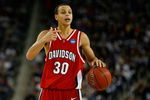 DETROIT - MARCH 30:  Stephen Curry #30 of the Davidson Wildcats directs the offense against the Kansas Jayhawks during the Midwest Regional Final of the 2008 NCAA Division I Men's Basketball Tournament at Ford Field on March 30, 2008 in Detroit, Michigan. Kansas won 59-57.  (Photo by Gregory Shamus/Getty Images)