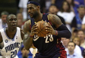ORLANDO, FL - MAY 30:  LeBron James #23 of the Cleveland Cavaliers handles the ball against Mickael Pietrus #20 of the Orlando Magic in Game Six of the Eastern Conference Finals during the 2009 Playoffs at Amway Arena on May 30, 2009 in Orlando, Florida. NOTE TO USER: User expressly acknowledges and agrees that, by downloading and or using this photograph, User is consenting to the terms and conditions of the Getty Images License Agreement  (Photo by Elsa/Getty Images)