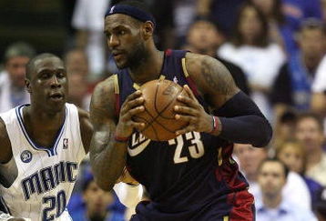 ORLANDO, FL - MAY 30:  LeBron James #23 of the Cleveland Cavaliers handles the ball against Mickael Pietrus #20 of the Orlando Magic in Game Six of the Eastern Conference Finals during the 2009 Playoffs at Amway Arena on May 30, 2009 in Orlando, Florida. NOTE TO USER: User expressly acknowledges and agrees that, by downloading and or using this photograph, User is consenting to the terms and conditions of the Getty Images License Agreement  (Photo by Elsa/Getty Images)