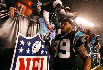 CHARLOTTE, NC - JANUARY 10:  Steve Smith #89 of the Carolina Panthers shakes hands with fans after being defeated 33-13 by the Arizona Cardinals during the NFC Divisional Playoff Game on January 10, 2009 at Bank of America Stadium in Charlotte, North Carolina.  (Photo by Streeter Lecka/Getty Images)