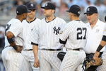 NEW YORK - MAY 21:  Joba Chamberlain #62 of the New York Yankees is pulled from the game by manager Joe Girardi #27 after he was hit in the leg against the Baltimore Orioles on May 21, 2009 at Yankee Stadium in the Bronx borough of New York City.  (Photo by Nick Laham/Getty Images)