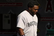 ANAHEIM, CA - MAY 14:  David Ortiz #34 of the Boston Red Sox walks in the dugout after grounding out for the final out with the bases loaded in the 12th inning against  the Los Angeles Angels of Anaheim on May 14, 2009 at Angel Stadium in Anaheim, California.  The Angels won 5-4 in 12 innings.   (Photo by Stephen Dunn/Getty Images)