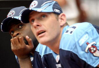 HOUSTON - OCTOBER 21:  Quarterback Vince Young #10 of the Tennessee Titans sits on the bench next to Kerry Collins #5 as they both watch action on the jumbotron during the 1st half of the game against the Houston Texans on October 21, 2007 at Reliant Stadium in Houston Texas.  (Photo by Jamie Squire/Getty Images)