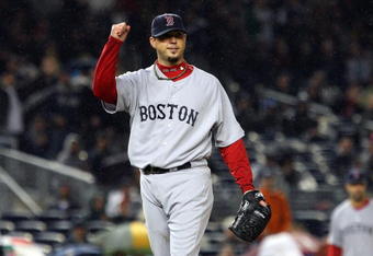 NEW YORK - MAY 05:  Josh Beckett #19 of the Boston Red Sox celebrates the final out of the sixth inning against the New York Yankees on May 5, 2009 at Yankee Stadium in the Bronx borough of New York City. The Red Sox defeated the Yankees 7-3.  (Photo by Jim McIsaac/Getty Images)