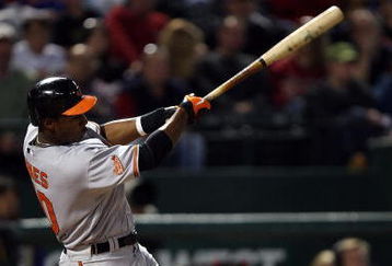 ARLINGTON, TX - APRIL 13:  Adam Jones #10 of the Baltimore Orioles hits a RBI double against the Texas Rangers in the fourth inning on April 13, 2009 at Rangers Ballpark in Arlington, Texas.  (Photo by Ronald Martinez/Getty Images)