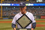 ST. PETERSBURG, FL - APRIL 19: Manager Joe Maddon #70 of the Tampa Bay Rays receives the American League coach of the year award before play against the Chicago White Sox April 19, 2009 at Tropicana Field in St. Petersburg, Florida.  (Photo by Al Messerschmidt/Getty Images)