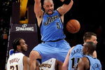 LOS ANGELES, CA - APRIL 19:  Carlos Boozer #5 of the Utah Jazz dunks the ball in the third quarter against the Los Angeles Lakers in Game One of the Western Conference Quarterfinals during the 2009 NBA Playoffs at Staples Center on April 19, 2009 in Los Angeles, California. NOTE TO USER: User expressly acknowledges and agrees that, by downloading and or using this photograph, User is consenting to the terms and conditions of the Getty Images License Agreement.  (Photo by Kevork Djansezian/Getty Images)