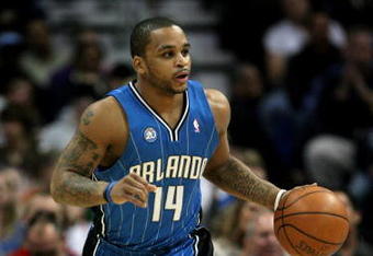 DENVER - JANUARY 17:  Jameer Nelson #14 of the Orlando Magic dribbles the ball upcourt against the Denver Nuggets during NBA action at the Pepsi Center on January 17, 2009 in Denver, Colorado. The Magic defeated the Nuggets 106-88. NOTE TO USER: User expressly acknowledges and agrees that, by downloading and or using this Photograph, user is consenting to the terms and conditions of the Getty Images License Agreement.  (Photo by Doug Pensinger/Getty Images)