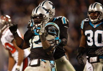 CHARLOTTE, NC - DECEMBER 08:  Jon Beason #52 of the Carolina Panthers reacts to making a stop on defense against the Tampa Bay Buccaneers at Bank of America Stadium on December 8, 2008 in Charlotte, North Carolina  (Photo by Streeter Lecka/Getty Images)