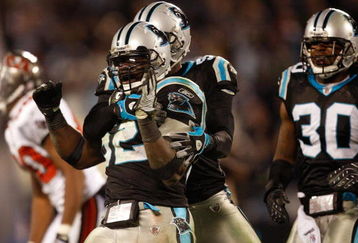 CHARLOTTE, NC - DECEMBER 08:  Jon Beason #52 of the Carolina Panthers reacts to making a stop on defense against the Tampa Bay Buccaneers at Bank of America Stadium on December 8, 2008 in Charlotte, North Carolina  (Photo by Streeter Lecka/Getty Images)