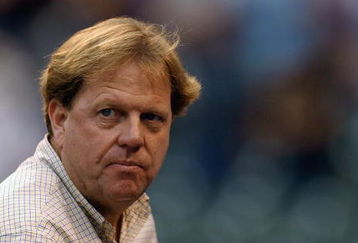 CHICAGO - AUGUST 1:  General Manager Jim Hendry of the Chicago Cubs checks the weather conditions during a rain delay in the National League game between the Chicago Cubs and the Arizona Diamondbacks at Wrigley Field on August 1, 2003 in Chicago, Illinois. The Cubs won 4-3.  (Photo by Jonathan Daniel/Getty Images)