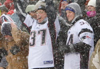 FOXBORO, MA - DECEMBER 21: Fans of the New England Patriots react after touchdown against the Arizona Cardinals at Gillette Stadium on December 21, 2008 in Foxboro, Massachusetts. The Patriots won 47-7. (Photo by Jim Rogash/Getty Images)