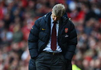 LONDON - FEBRUARY 21:  Manager of Arsenal Arsene Wenger looks dejected during the Barclays Premier League match between Arsenal and Sunderland at Emirates Stadium on February 21, 2009 in London, England.  (Photo by Phil Cole/Getty Images)