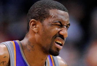 LOS ANGELES, CA - FEBRUARY 18:  Amar'e Stoudamire #1 of the Phoenix Suns reacts after getting a finger in his left eye during the first half against Los Angeles Clippers at the Staples Center on February 18, 2009 in Los Angeles, California. Stoudamire scored a game high 42 points and the Suns won, 142-119. NOTE TO USER: User expressly acknowledges and agrees that, by downloading and or using this photograph, User is consenting to the terms and conditions of the Getty Images License Agreement.  (Photo by Kevork Djansezian/Getty Images)